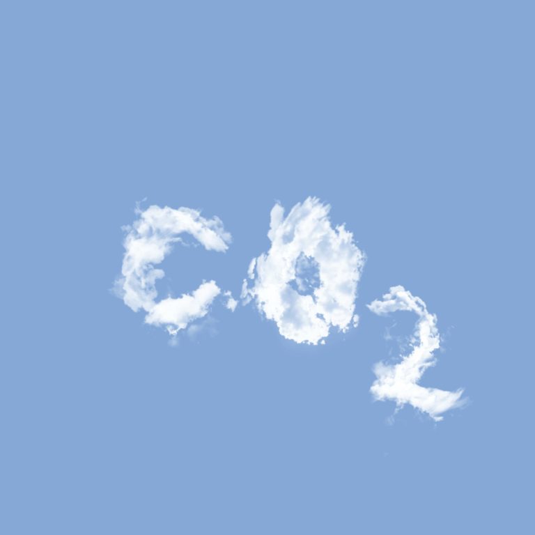 "CO2" with the letters and numbers made of clouds in the blue sky