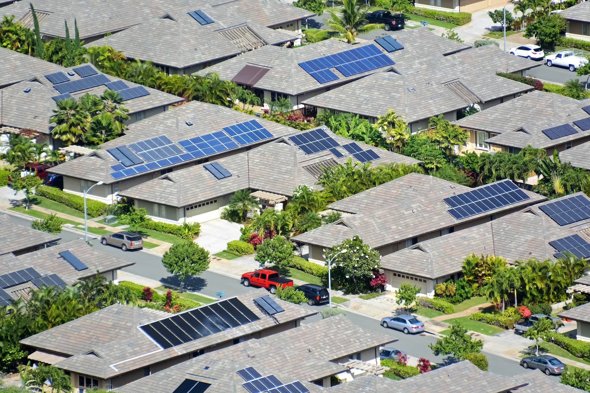 Aerial view of sub-urban neighborhood with solar panels on the roofs