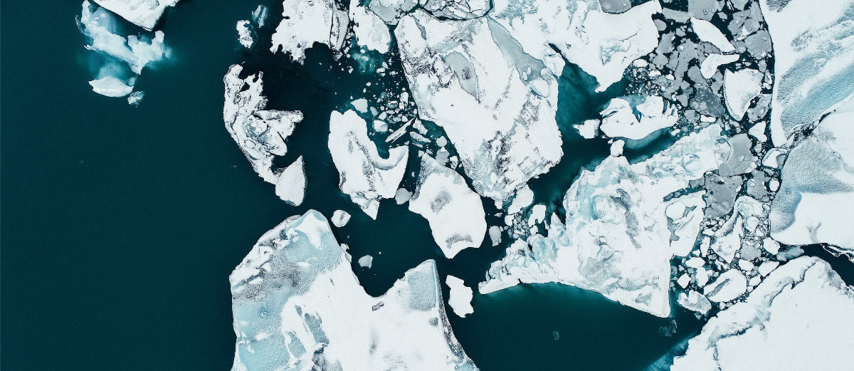 Icecaps melting in a dark blue ocean